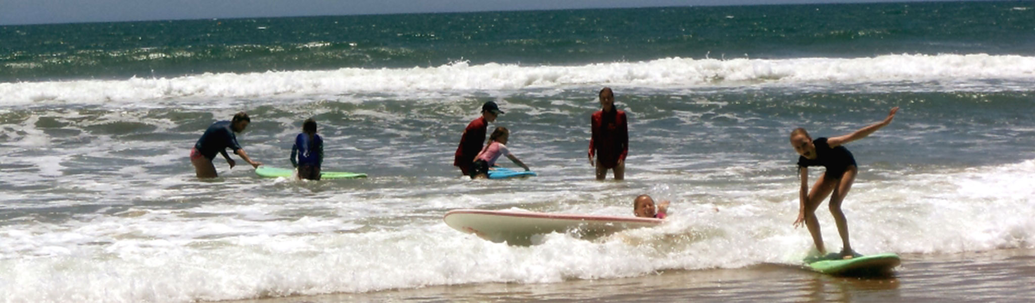 Mapleton State School students surfing at the beach